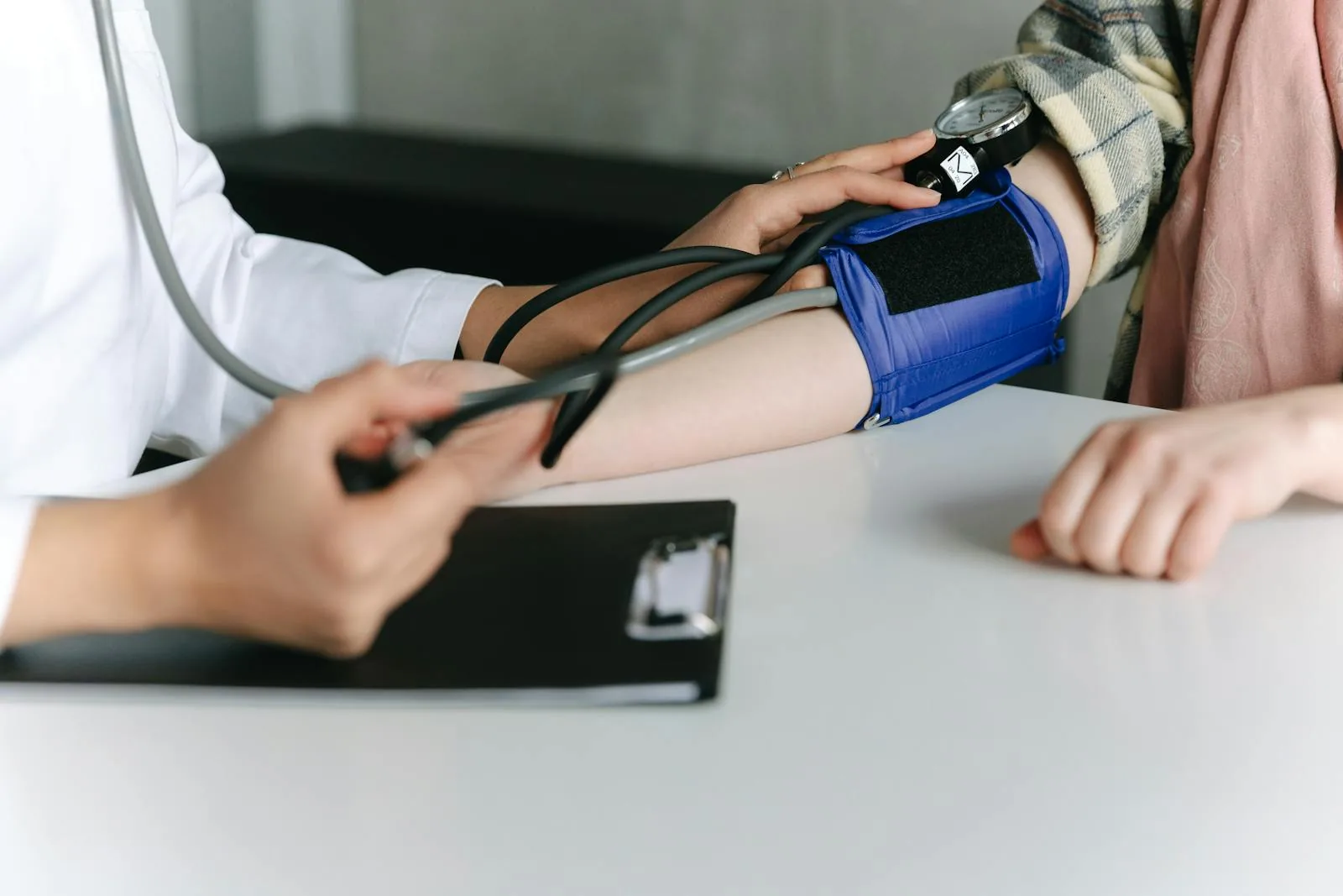 A blood-pressure cuff being used during a routine health check